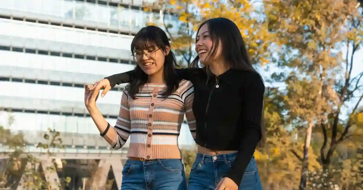 Link Between Social Relationships and Mental Health Two friends walking outdoors, illustrating the link between social relationships and mental health
