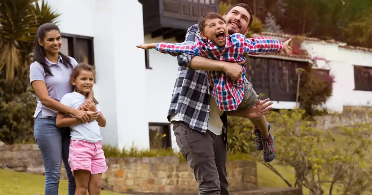 Family spending time together outdoors, showing joyful connection and support during challenging times