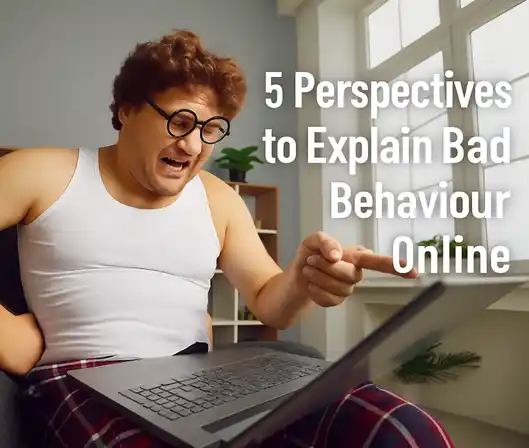 A person wearing glasses points at a computer screen, symbolizing online interaction and the concept of digital disrespect.