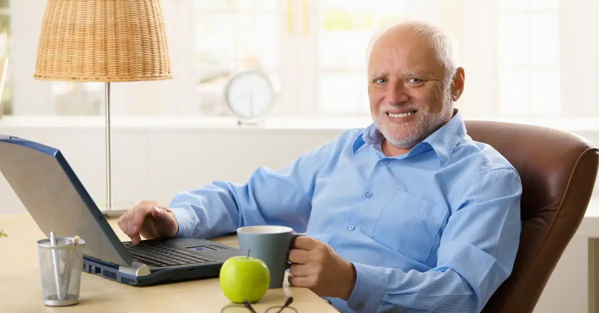 group-divides-online Person sitting alone at a laptop, highlighting feelings of isolation and social division in online groups.