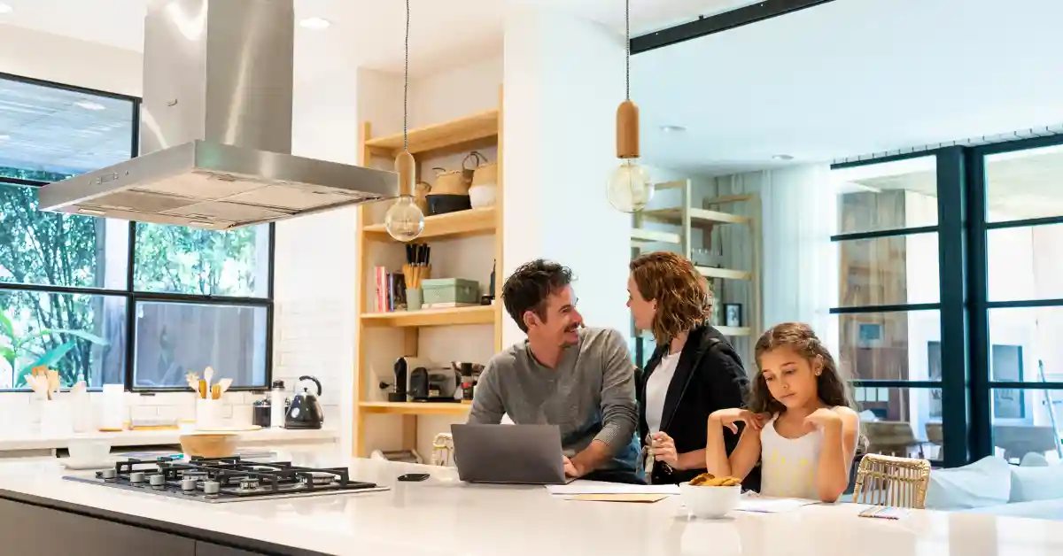 ripple-effect Group of people interacting around a kitchen table, representing how online behaviours create ripple effects in real life.